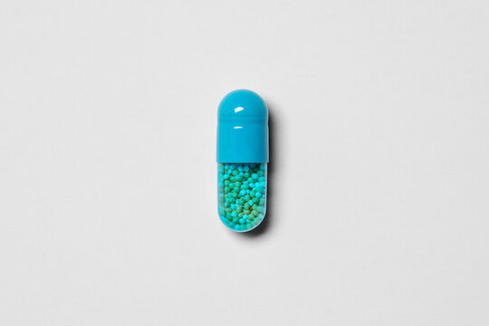 Amphetamine Salts XR 10mg Extended Release Capsule Isolated on transparent paper texture background, transparent shadow&ndash; ADHD Prescription Stimulant Medication Pharmaceutical Macro Studio Photography