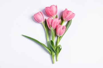Fototapeta premium Bouquet of pink tulips on white background, top view
