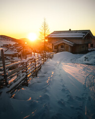 Winter Sunrise over Snow Covered Alpine Village in Falkert, Austria