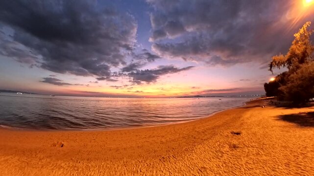 PATTAYA, THAILAND - NOVEMBER 2025 : View of Jomtien beach and beautiful sunset sky. Travel and tourism concept video. Time lapse shot.