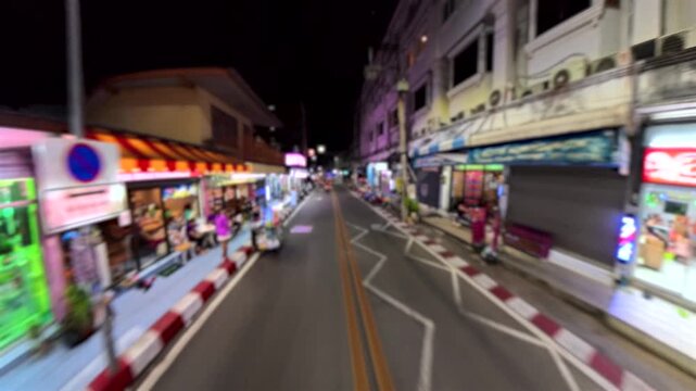 PATTAYA, THAILAND - NOV 2025 : Blurred view of Soi Buakhao street. Famous for beer bars, massages, hotel and various kind of nightlife places. Travel and tourism concept video.