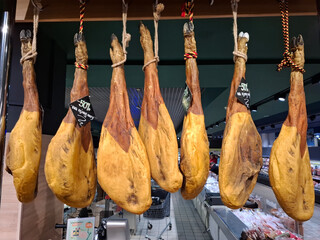 Large pigs legs are sold in supermarket. Pork
