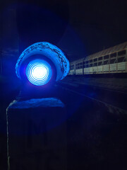 Blue railroad traffic light at night. Train traffic is prohibited
