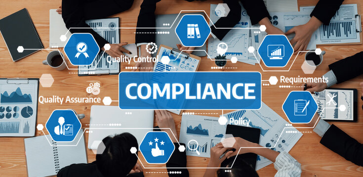 A diverse team engaged in a productive compliance meeting, reviewing data and quality control strategies in a modern office, highlighting collaboration and regulatory needs. Amity