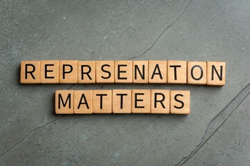 Obraz premium Wooden Tiles Spell Out 'Representation Matters'