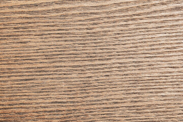 Natural wood grain texture background. Horizontal tree rings pattern surface. Warm brown timber structure closeup. Organic material detail for design backdrop. Rustic wooden plank texture.