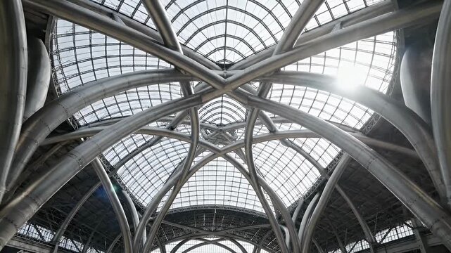 Modern vaulted ceiling with glass panels letting in bright daylight