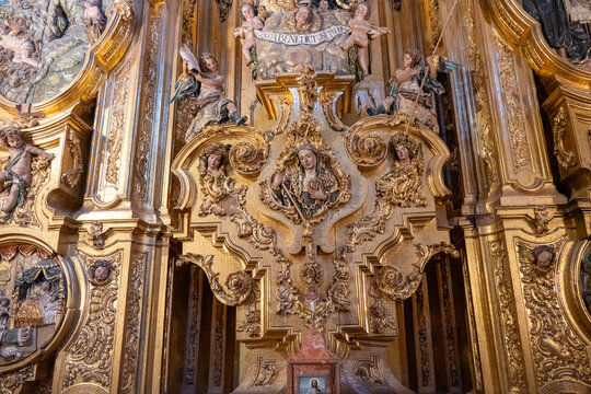 Gilded baroque altarpiece detail with angels in Jaen Cathedral, Spain