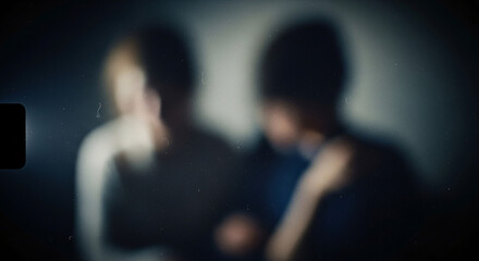 Blurred Silhouettes of Two People with Vintage Film Grain