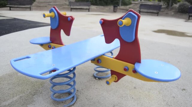 Children&rsquo;s Playground Equipment with Swings and Slide in Park