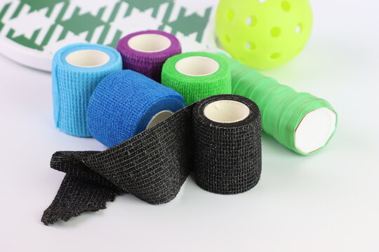 Colored Non adhesive tape close to a pickeball paddle