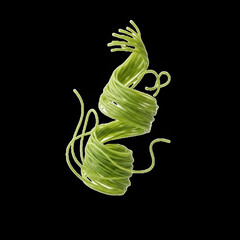 Vibrant green cable coiled in dynamic spiral motion