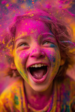 Happy girl celebrating Holi festival with colorful powder, joyful child laughing during traditional Indian celebration of colors