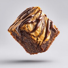 Decadent chocolate brownie with peanut butter swirl, drizzled with dark chocolate