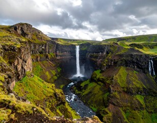 A majestic waterfall cascades down a rugged cliffside