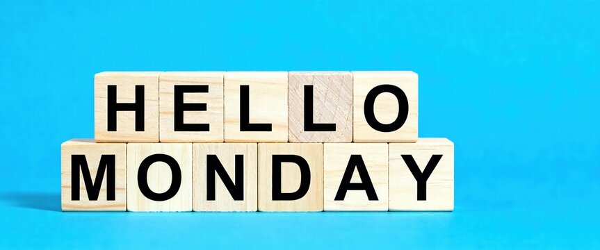 Hello Monday Wooden Blocks on Blue Background