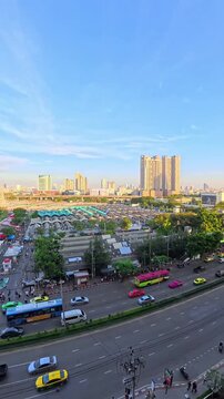 BANGKOK, THAILAND - NOV 2025 : Aerial high angle view of Chatuchak Weekend Market. Largest market in Thailand. Travel and tourism concept video. Time lapse shot, sunset to night.