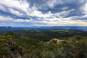Fototapeta premium Scenic view from Hargraves Lookout in the Blue Mountains overlooking Grose Valley with forested landscape and rugged sandstone cliffs.