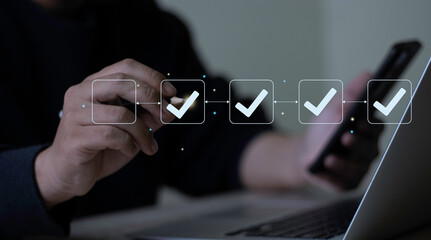 Person using laptop with virtual checklist and progress icons. Concept of project planning, workflow management, and efficient step-by-step execution.Automating business processes.