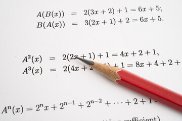 Pencil on mathematic formula exercise test paper in education school.