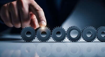 Hand adjusting metal gear on table representing change management transformation, strategy alignment, process optimization and leadership intervention.  Photo | copy space 