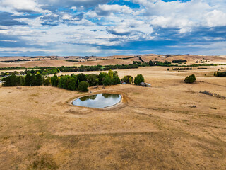 Cloud‑Laced Skies at Golden Hour Over Farmland