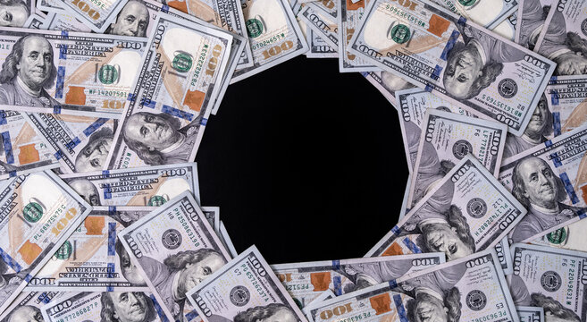 Money frame with bills and copy space for text. US currency and banknotes. 100 USD notes forming a border for finance concept. American dollars background with design space. Pattern of cash and bills.