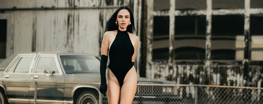 Fashion model. Street Fashion model walking near retro car outdoor. Sexy glamour woman in trendy fashion bodysuit. Beauty trends. Pretty Girl. Perfect fashionable lady. Sexy fashion. Charisma stylish