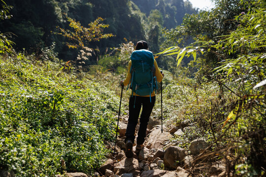 Woman backpacker hking in the mountains