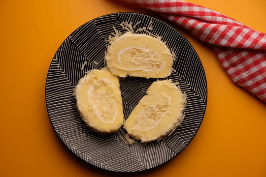 A roll cake is a sponge cake baked in a shallow pan, filled with jam or buttercream and then rolled. Roll cakes are often known as jam rolls, or jelly rolls in the US. cheese cake. bolu meranti.