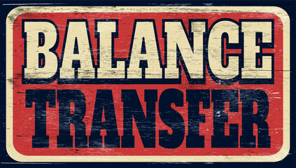 Aged and worn balance transfer sign on wood