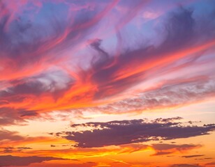 Fototapeta premium Vivid sunset with streaks of fiery orange and purple hues