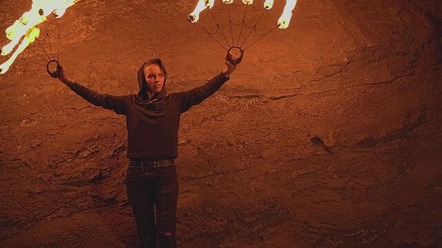 Fire show. Fire. Fan. Black clothes. Night. Woman. Slow motion video. High quality 4k footage