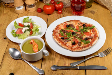 Appetizing Food Spread Pizza, Soup, and Salad for a Meal