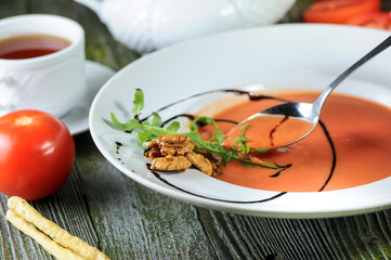 Gourmet Tomato Soup with Balsamic Glaze and Fresh Ingredients