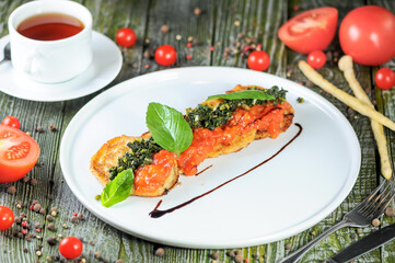 Gourmet Bruschetta Appetizer with Pesto and Cherry Tomatoes