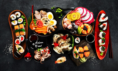 Table served with sushi and traditional japanese food.
