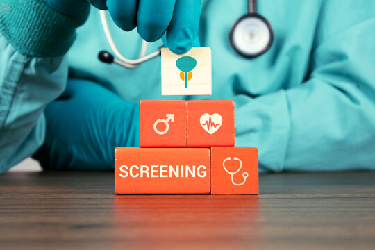 Concept of precision medicine for prostate cancer screening and awareness in men. The urologist's hand arranges wooden cubes with the prostate and bladder icons.