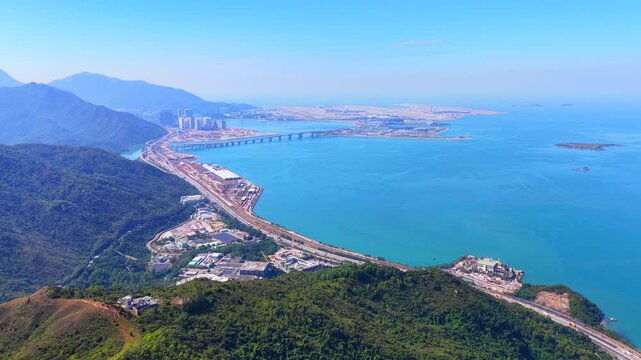 Skyview of lantau island siu ho wan tung chung new town and hong kong zhuhai macau bridge artificial island near chek lap kok airport showcasing greater bay area logistics growth
