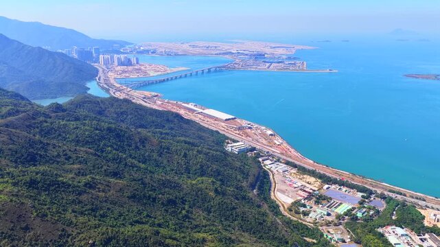 Skyview of lantau island siu ho wan tung chung new town and hong kong zhuhai macau bridge artificial island near chek lap kok airport showcasing greater bay area logistics growth
