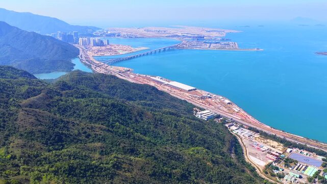 Skyview of lantau island siu ho wan tung chung new town and hong kong zhuhai macau bridge artificial island near chek lap kok airport showcasing greater bay area logistics growth