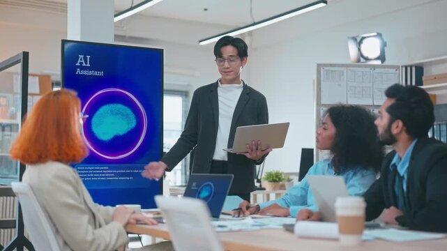 Global professionals including Asian, Indian, and Caucasian colleagues interacting with AI voice technology on screen, waiting and listening to audio feedback in a modern office.
