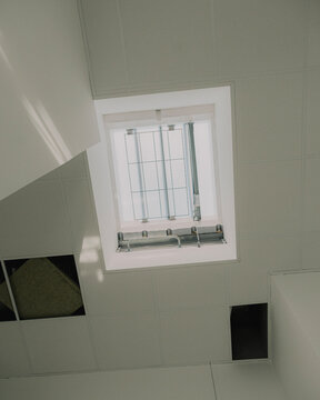 Modern suspended ceiling with skylight in renovated building
