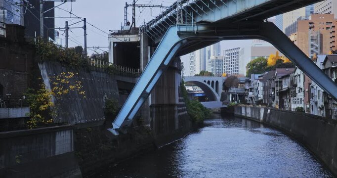 Overpass over canal in Japanese city - wide shot