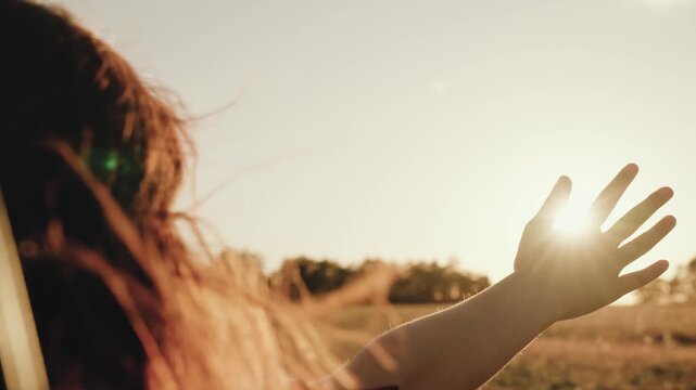 Woman girl hand in the window, girl Roadside relaxation, wistful thinking, joyful ride, country vibe, hand out enjoying air, free and young, scenic landscape, feeling adventurous, limitless journey