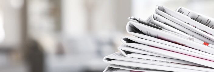 Many newspapers in light room