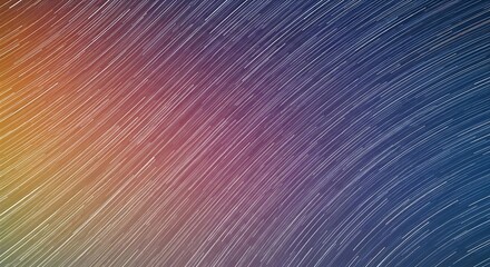 Time-lapse shot of celestial streaks across a gradient, vibrant sky
