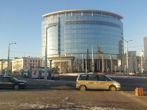 Modern glass building of the Faculty of International Relations of Belarusian State University at Railway Station square on a sunny winter day in Minsk, 2014 