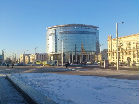 Modern glass building of the Faculty of International Relations of Belarusian State University at Railway Station square on a sunny winter day in Minsk, 2014 