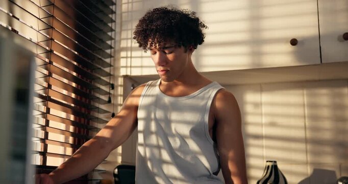 Thinking, worry and man in home by window with disappointment, failure and upset in morning. Kitchen, mistake and person with thoughtful, reflection and sad for job loss, unemployment and burnout